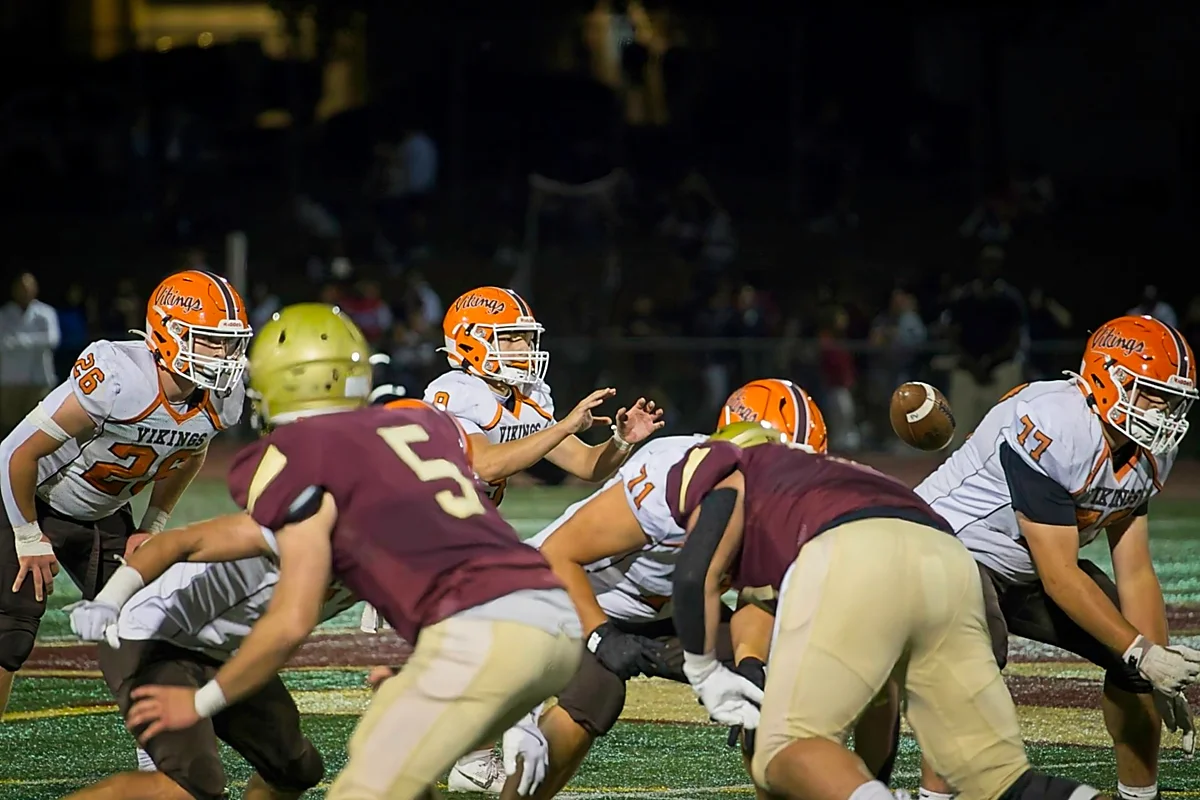 QB taking the snap to get the play started