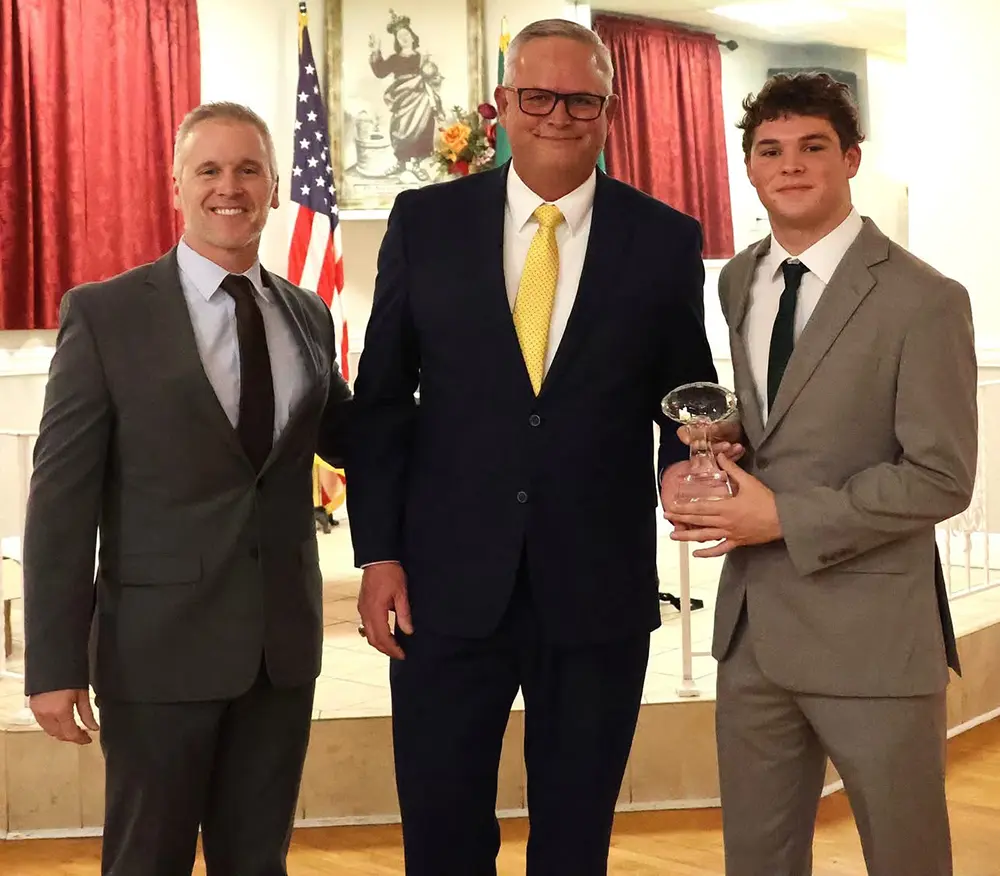 Juliun Corropese receiving his hardware