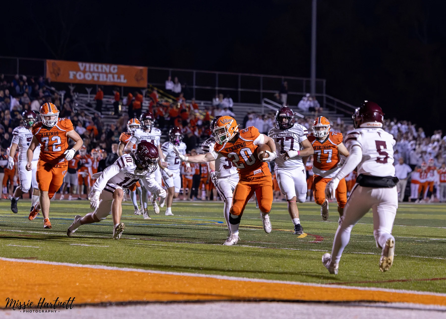 RB with the stiff arm headed to the endzone